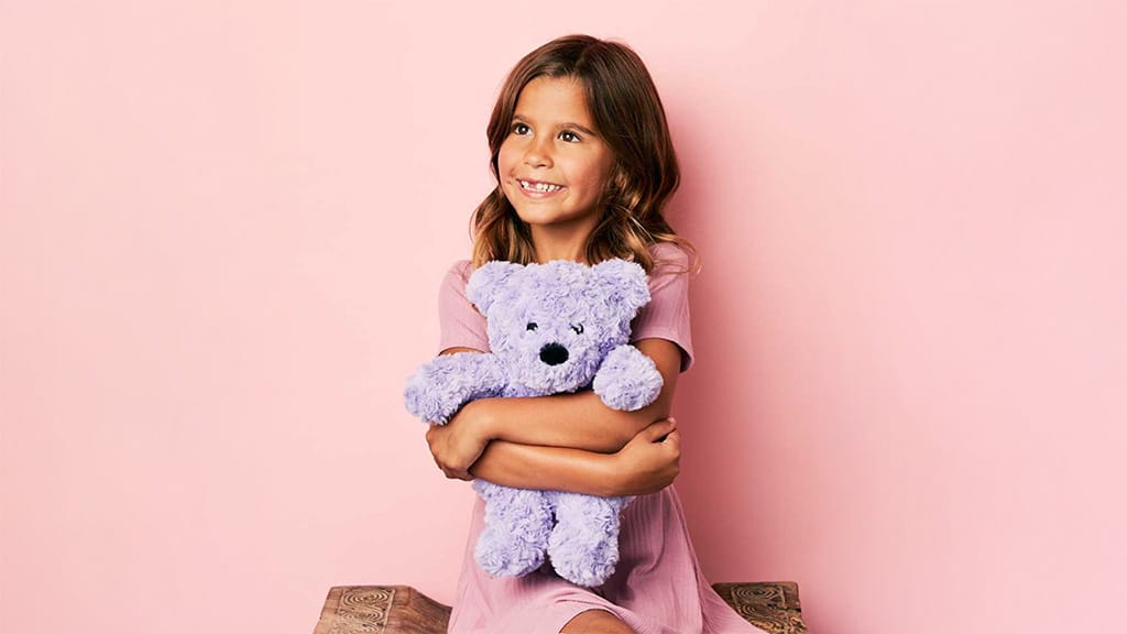 Warmies lila lockiger Bär